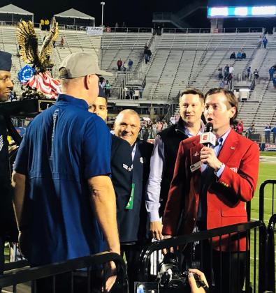 Bowl Chairman Art Carmody IV presents Tech coach Skip Holtz with Independence Bowl trophy along with Walk On’s Founder Brandon Landry and the “Ultimate Walk On” Notre Dame Rudy Ruettiger.