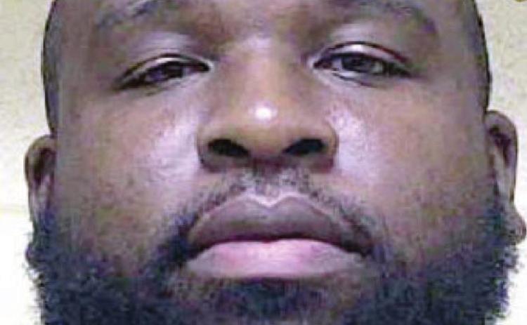 Man behind bars for possession of drugs, guns