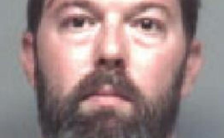Man throws flower pot at car, charged with criminal damage