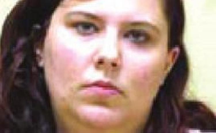 Cashier charged with embezzlement