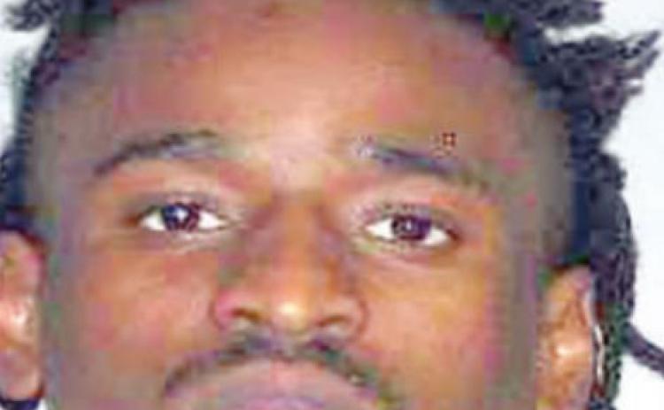 Man with gun charged with violating protective order