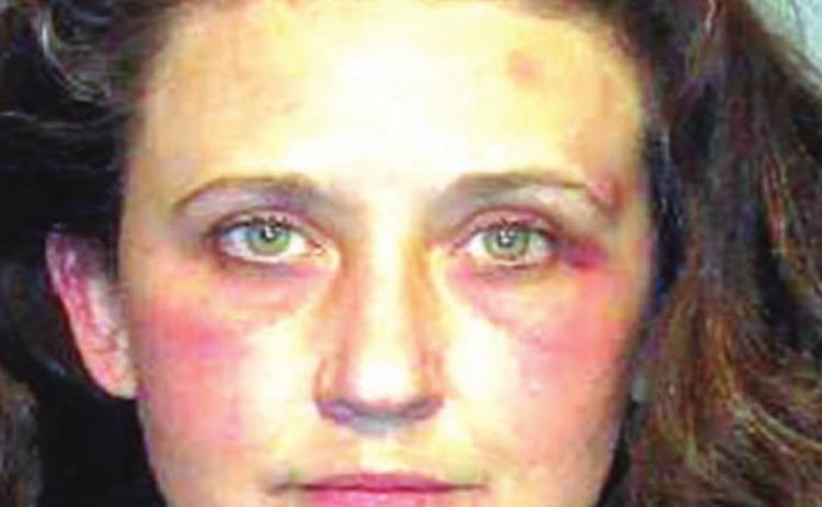 Woman charged with stabbing husband