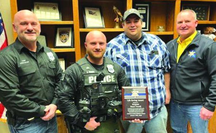 Minden officer receives award after saving deputy, long-time friend who was hit by car on-duty
