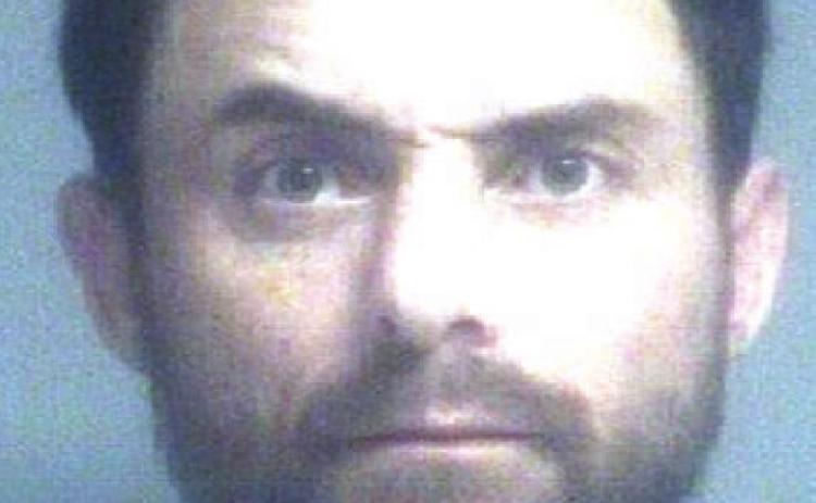 Man arrested after trying to discard drugs