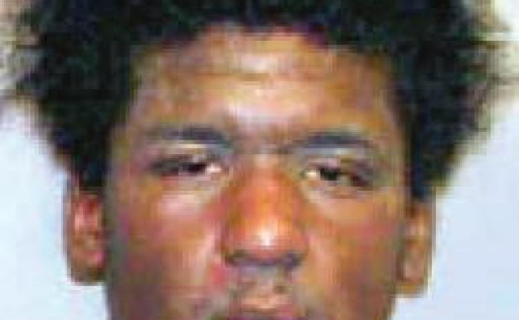 Man arrested with cell phone stolen in vehicle burglary