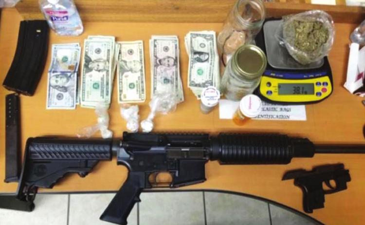 Man rear-ends deputy; guns and drugs found inside vehicle