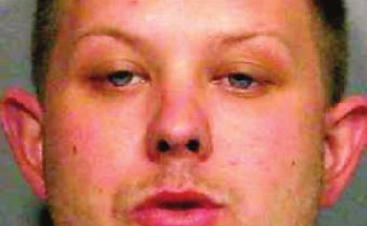 Man arrested for setting house afire, threatening deputies