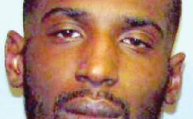 Suspect in May shooting surrenders to local police