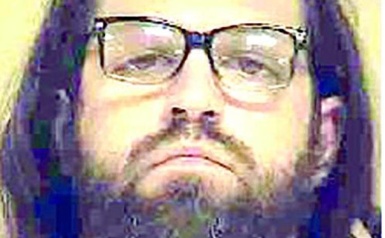 Two arrested following attack with hammer