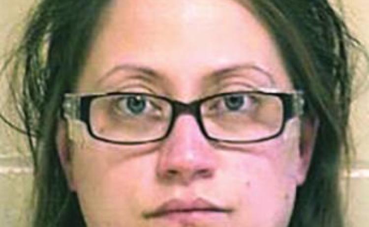 Woman leaves child in car in parking lot
