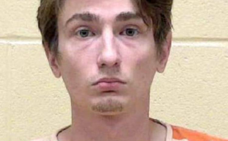 Man arrested in parking lot shooting
