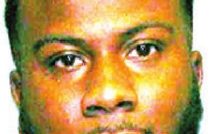 Man found with marijuana, weapon in parked vehicle