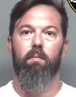 Man throws flower pot at car, charged with criminal damage