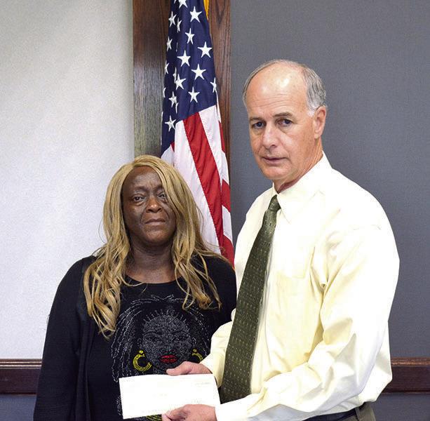 Bossier sheriff presents check to mother of homicide victim