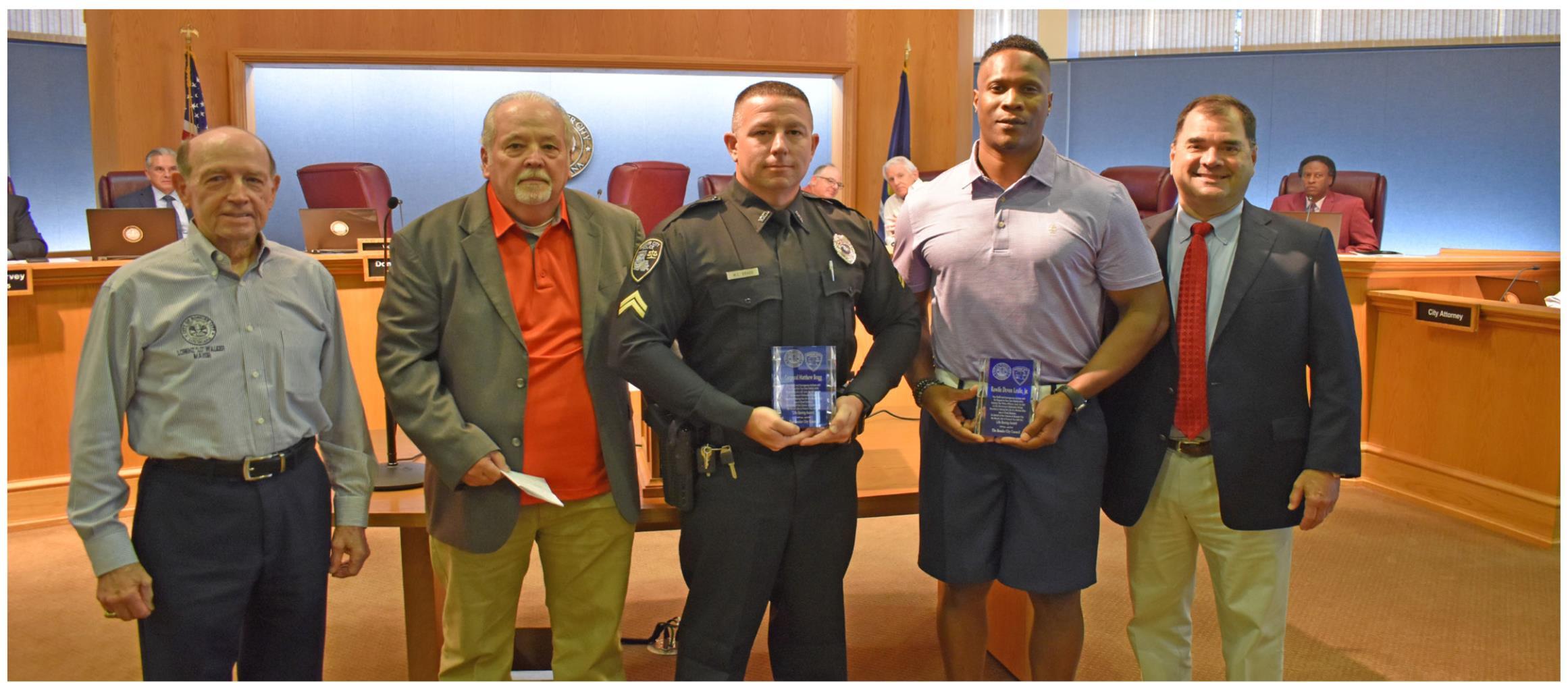 Bossier City Police Cpl. Matthew Bragg, Officer Brandon Bailey and Rawlis Leslie were recognized