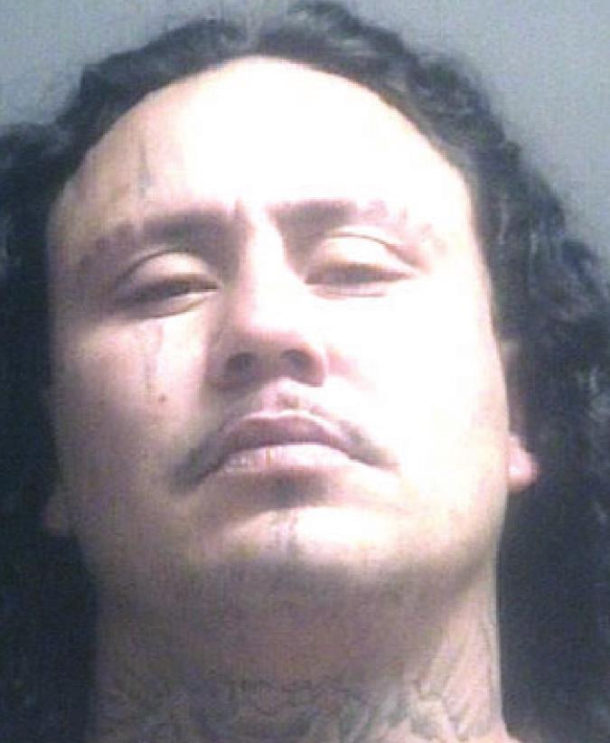 Man threatens brother with rifle, head-butts patrol vehicle cage