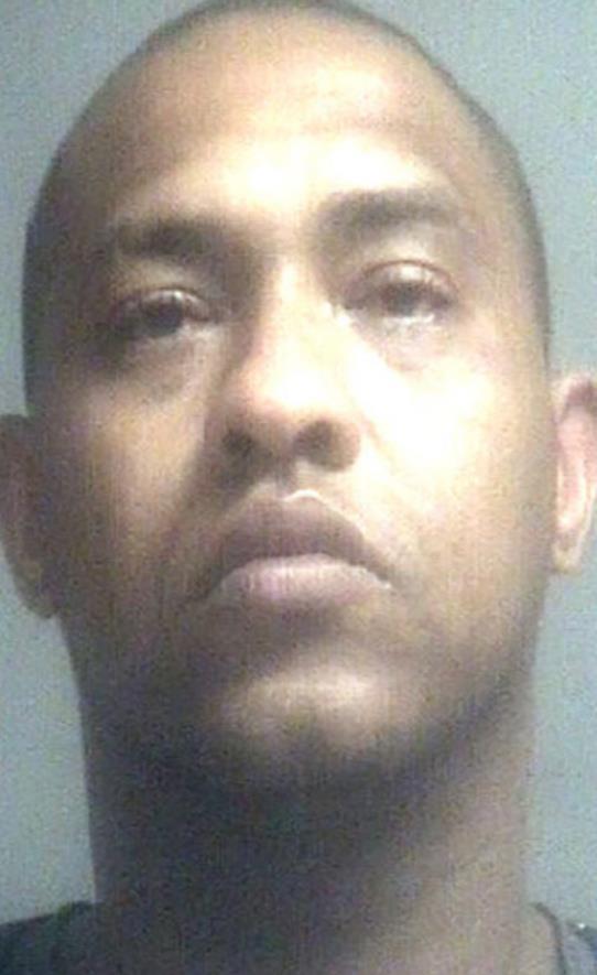 Man refuses to let two people leave Bossier motel room