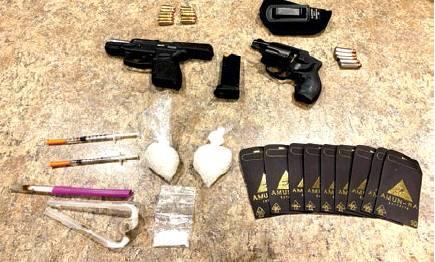Traffic stop leads to arrests for drugs, guns