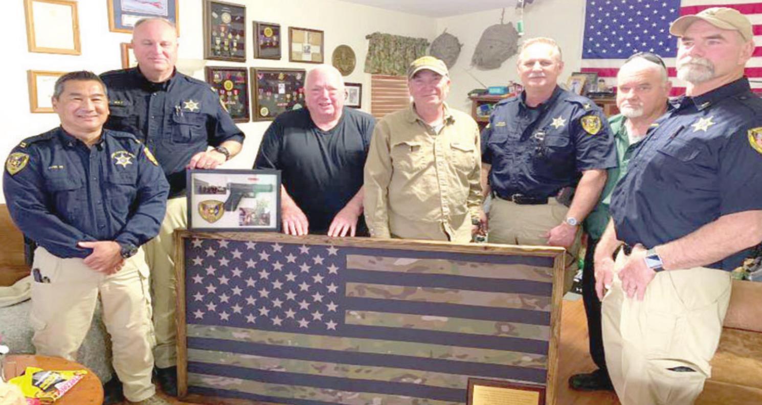 Flag, service weapon presented to ex-deputy battling cancer