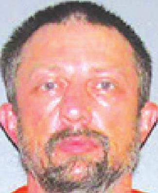 Suspect found behind motel with narcotics, paraphernalia