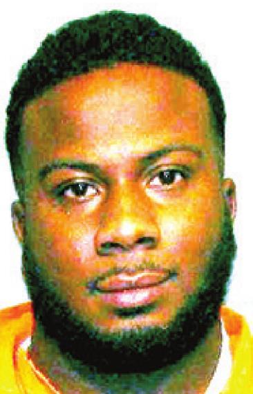 Man found with marijuana, weapon in parked vehicle