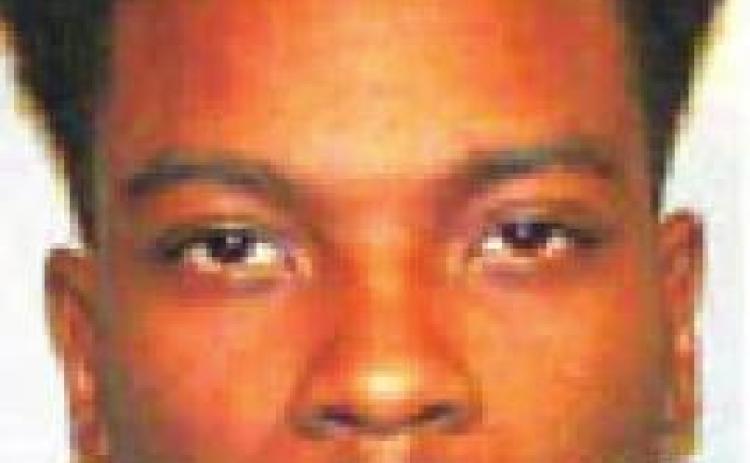 Traffic stop yields stolen gun, marijuana in vehicle
