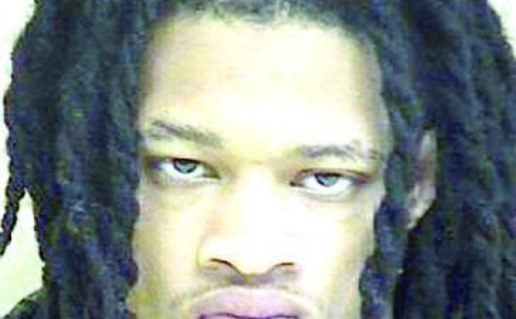 Two convicted felons arrested with firearms