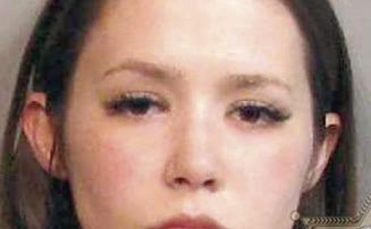 Woman arrested with a firearm