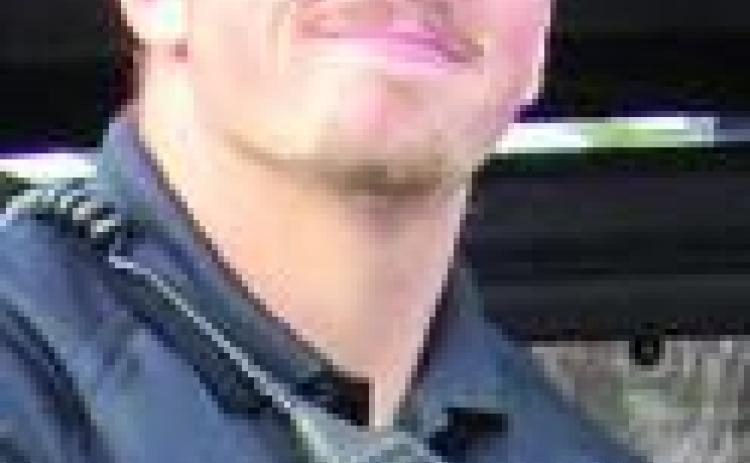 Officer accused of killing suspect resigns