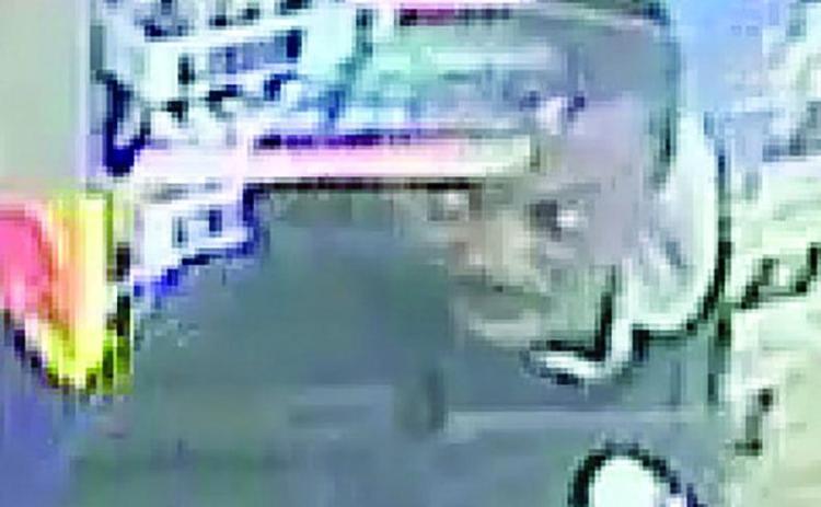 Police seek suspect in debit card theft