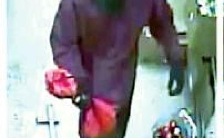 Police seek identity of robbery suspect