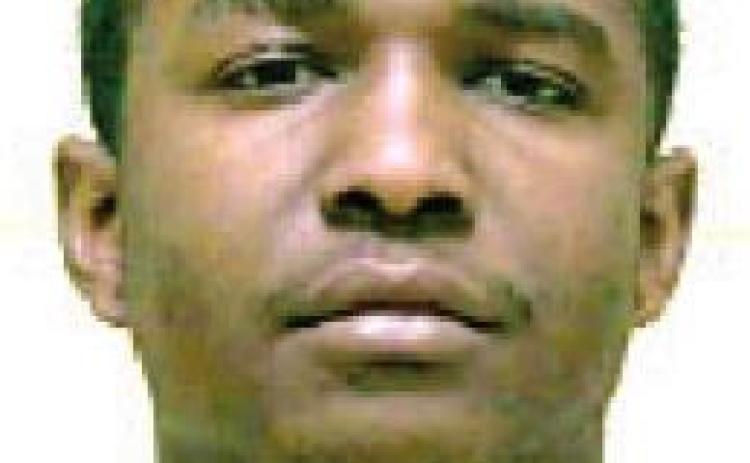 Man charged with flight, possession of firearm