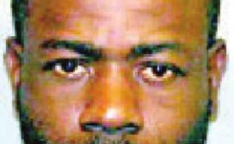 Man threatens woman by waving gun in her face