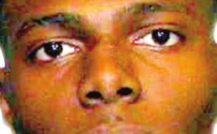 Suspect points gun at officer, who returns fire
