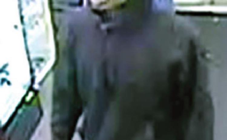Police seek ID of suspect in armed robbery