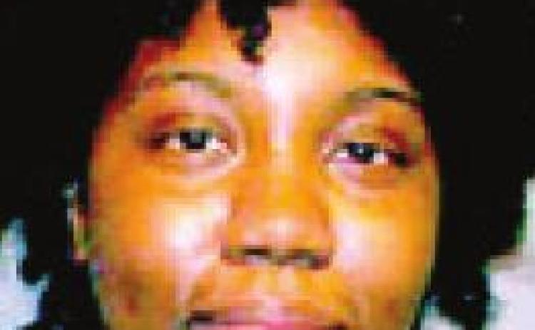 Woman strikes victim holding 3-week-old
