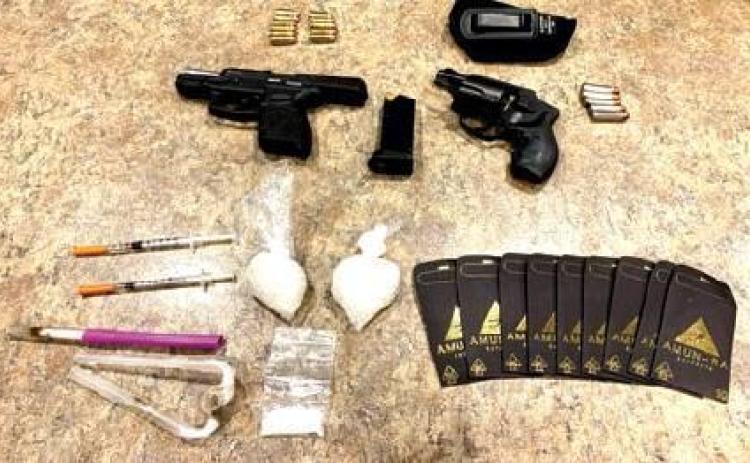 Traffic stop leads to arrests for drugs, guns