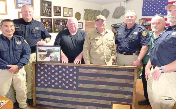 Flag, service weapon presented to ex-deputy battling cancer