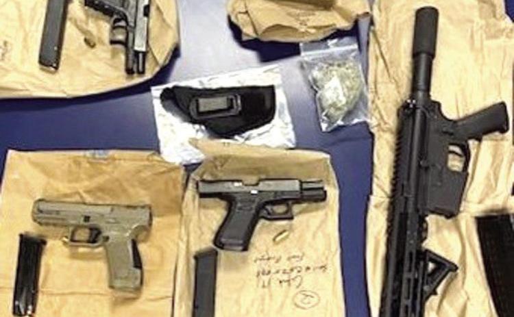 Four arrested for handling machine guns, possessing drugs