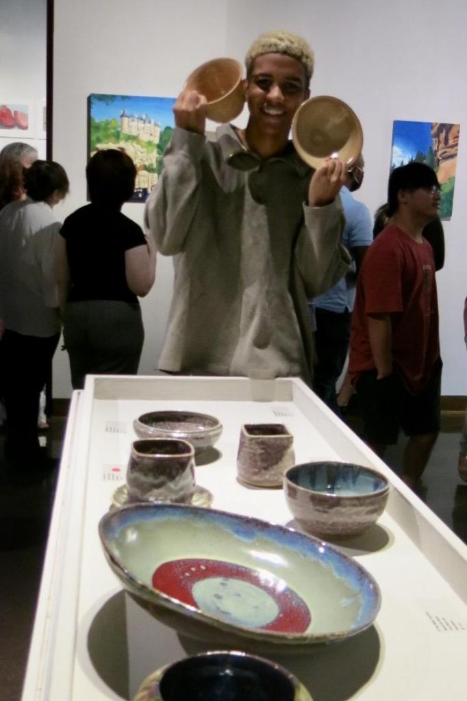 Jamare Kai Boult shows some of his pottery.