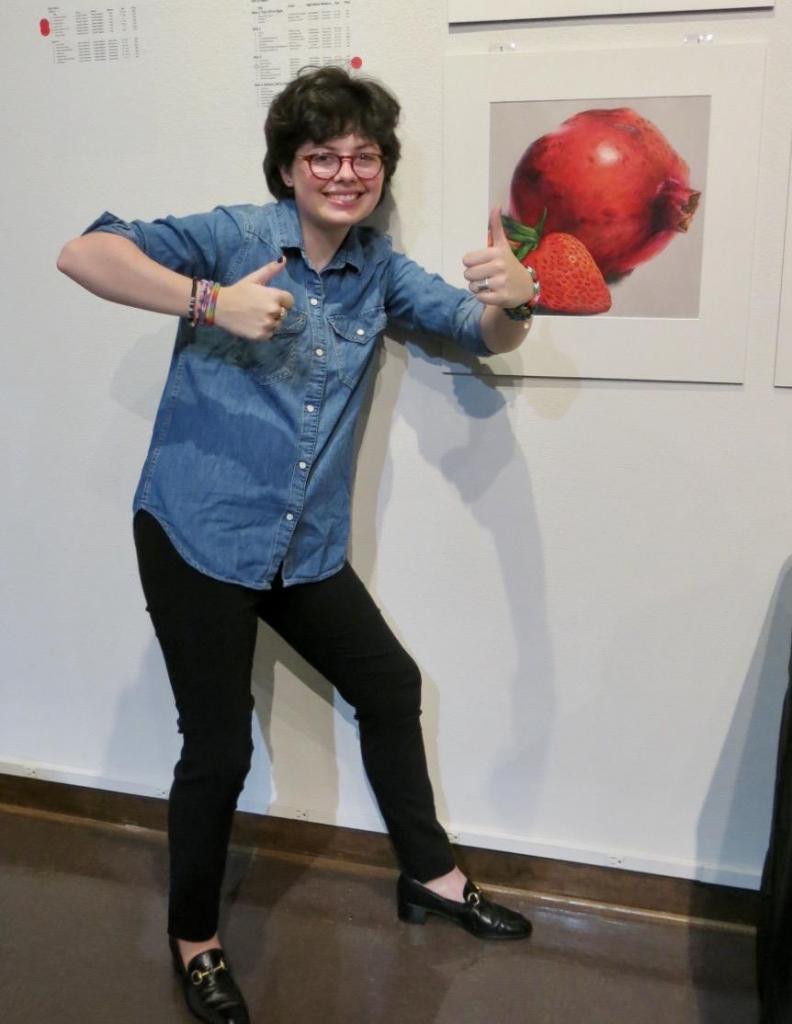 Charlotte &quot;Chuck&quot; White hams it up next to her work &quot;Persephone&quot;.