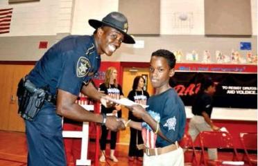 SRO Deputy Cedric Payne from Haughton Elementary School at D.A.R.E. graduation in spring 2019. 1,200 Bossier students to graduate DARE