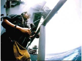 Boatswain's Mate Seaman Ressie Bates, from Shreveport, La., stands aft lookout watch on the fantail aboard the Nimitz-class aircraft carrier USS Abraham Lincoln (CVN 72). Abraham Lincoln Carrier Strike Group (ABECSG) is deployed to the U.S. 5th Fleet area Article Image Alt Text