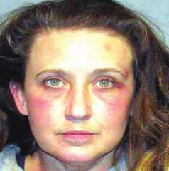 Woman charged with stabbing husband