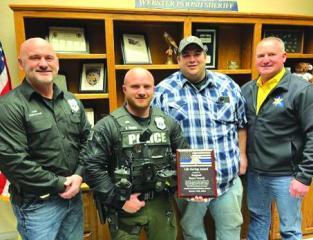 Minden officer receives award after saving deputy, long-time friend who was hit by car on-duty