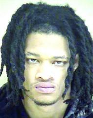 Two convicted felons arrested with firearms