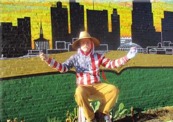 Muralist Chris Opp adds splashes of color to region