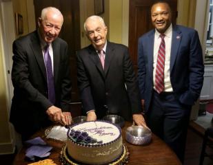 BOTTOM: Long Purple Line inductees Jerry Pierce and Tommy Whitehead with Northwestern Interim President Dr. Marcus Jones cut the celebratory cake. Roll out the NSU ‘Long Purple Line’