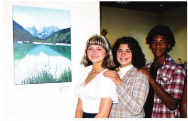 Alexandra Martinez, Ary Ravari and Supreme Burton with acrylic “Mountains and Trees and Water” by Martinez. AN ARTY AFFAIR