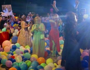 Revelers and balloons mingle on the dance floor at the Justinian Bal. KREWES SOBEK AND JUSTINIAN THROW GRAND BALLS SPECTACULARLY